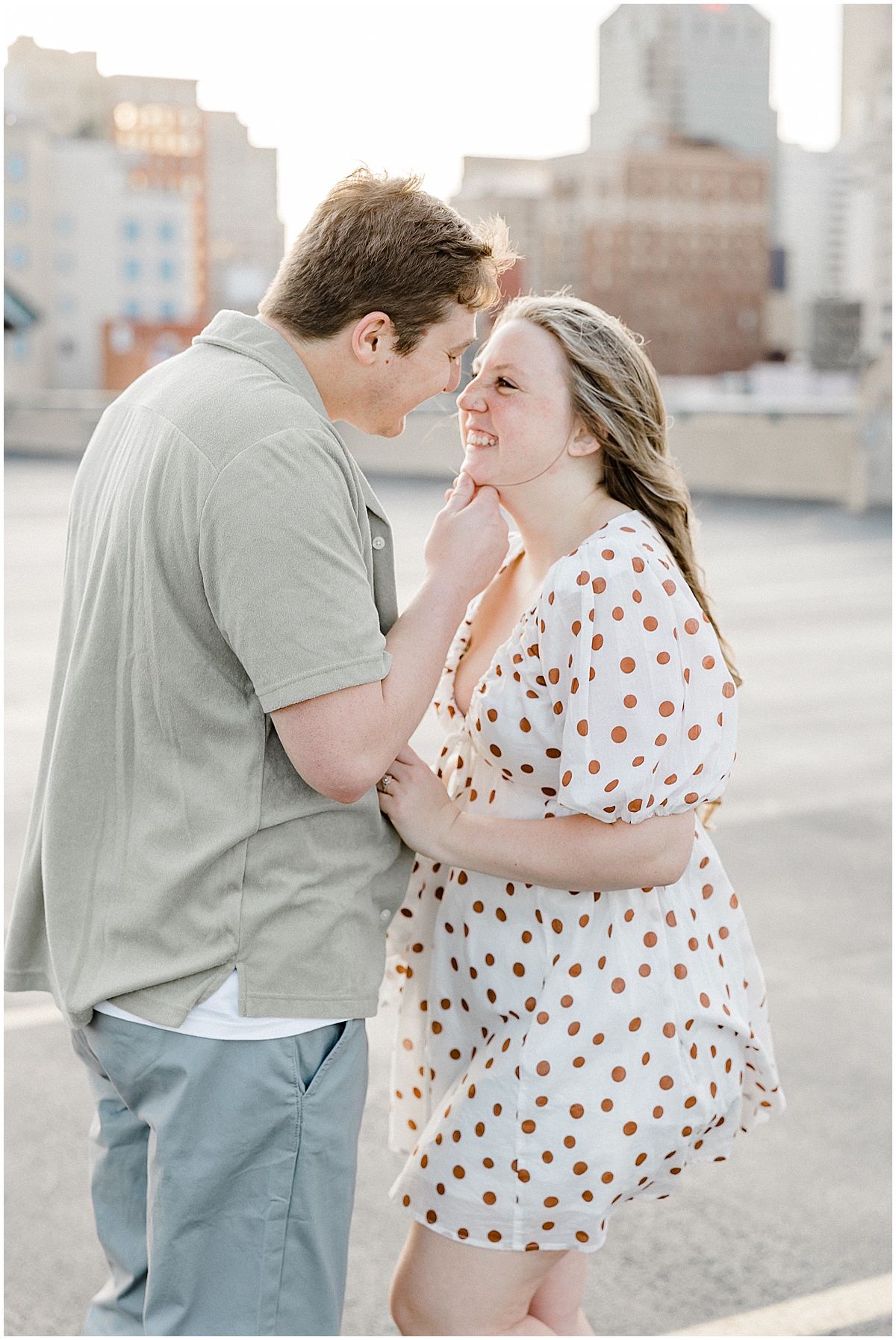 Indianapolis engagement photos on the rooftop of a parking garage.