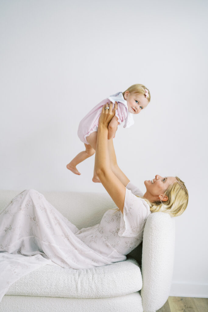 baby and mother playing