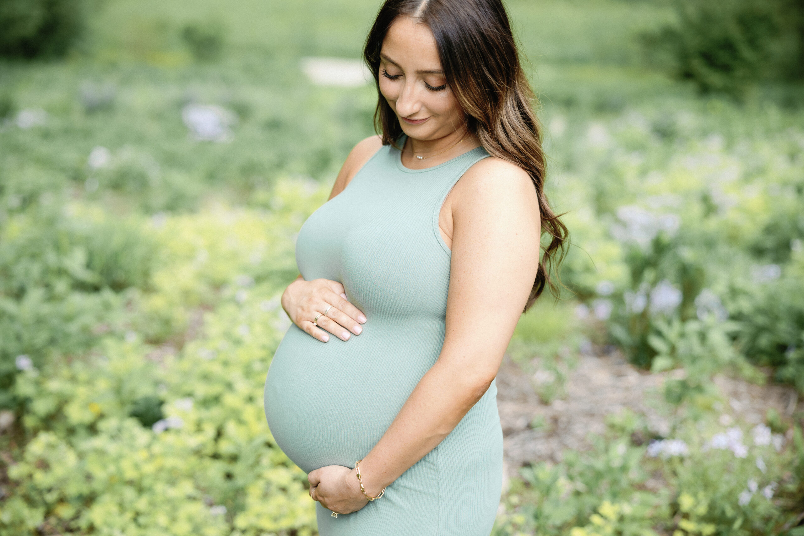 pregnant woman posing in field for indianapolis maternity photography