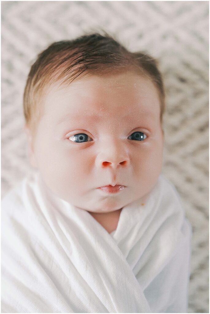 Kaitlin Mendoza captures Carmel, Indiana newborn photography of baby Noah during an in-home photo session.