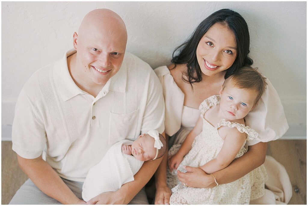 Family of four with newborn in Indianapolis Indiana wearing cream