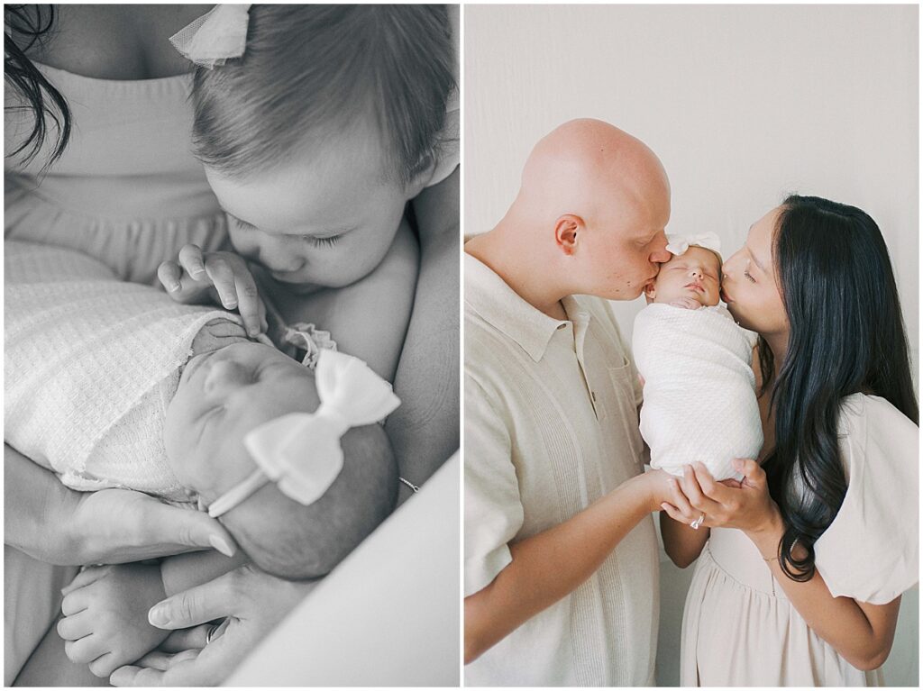 Parents kiss newborn in studio session