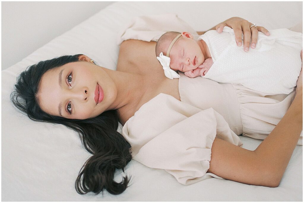 Cream and white studio session with mother and newborn in Indianapolis studio