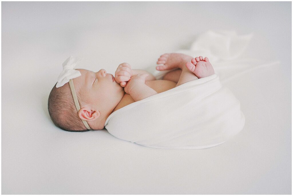 White swaddled newborn in Indianapolis studio session by Kaitlin Mendoza Photography