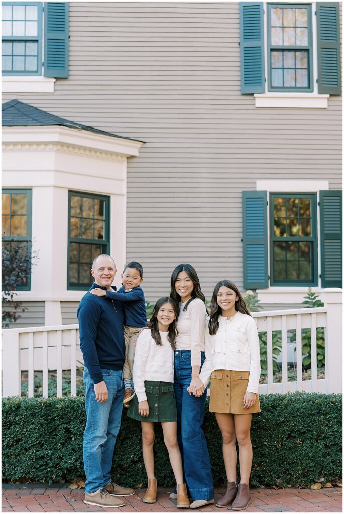 Family of 5 pose in front of Ambassador House in Fishers Indiana