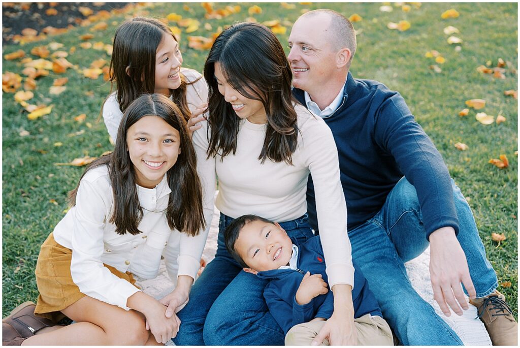 Fall leaves surround family during Indianapolis photo session
