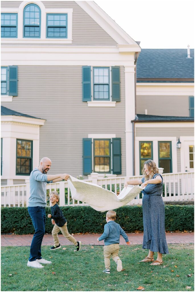 Kids run under blanket during fall mini session in Indianapolis