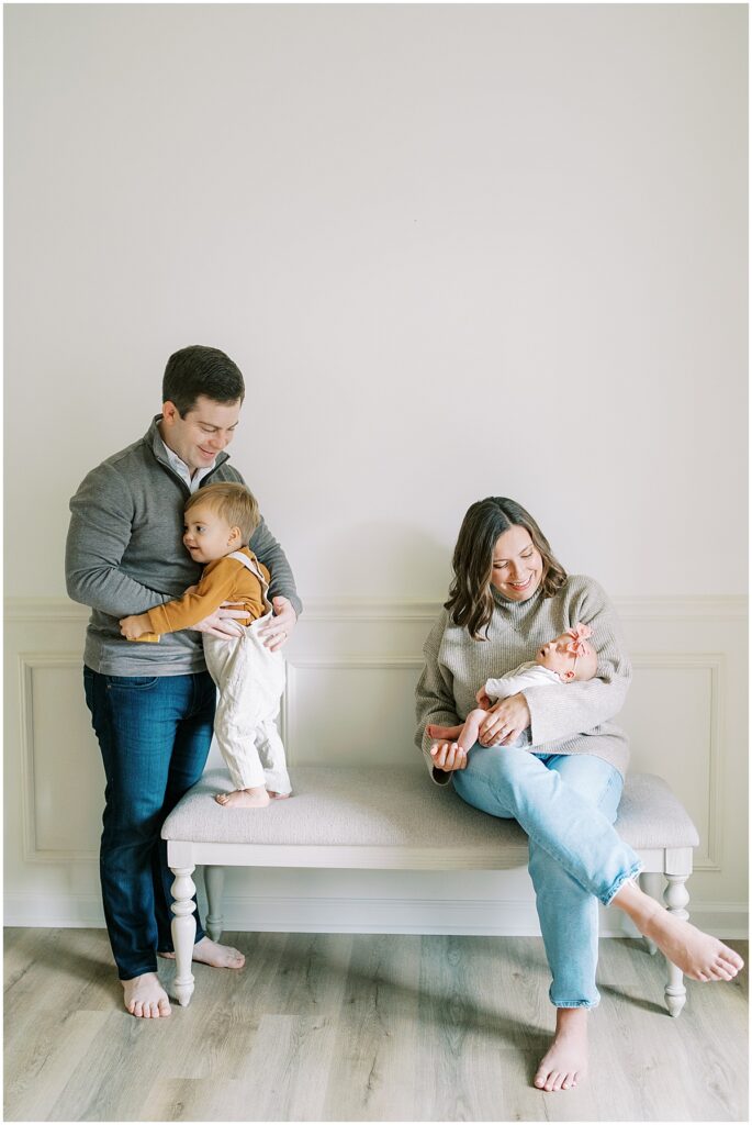 Family sit together during Indianapolis newborn photos