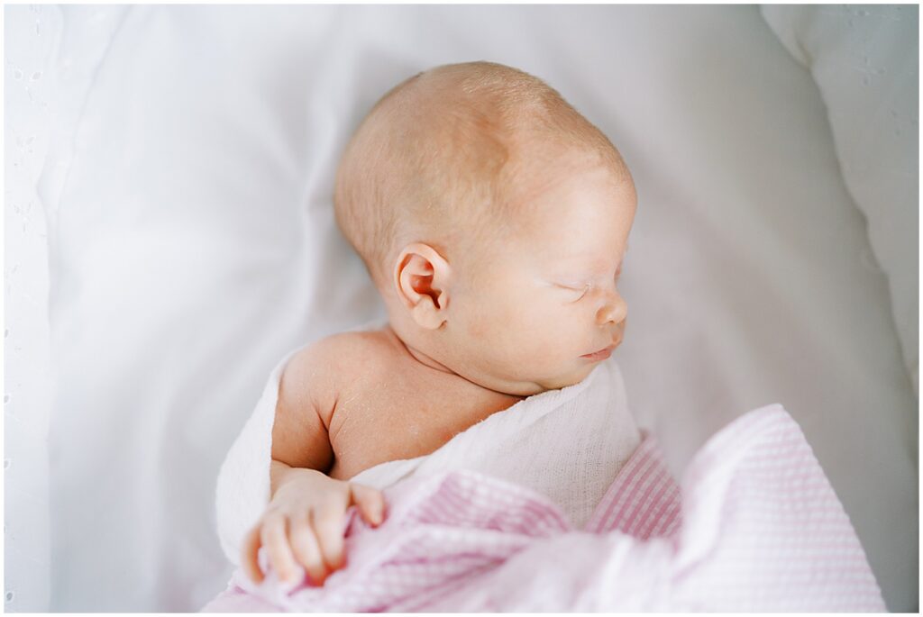Newborn in cradle during studio newborn photos