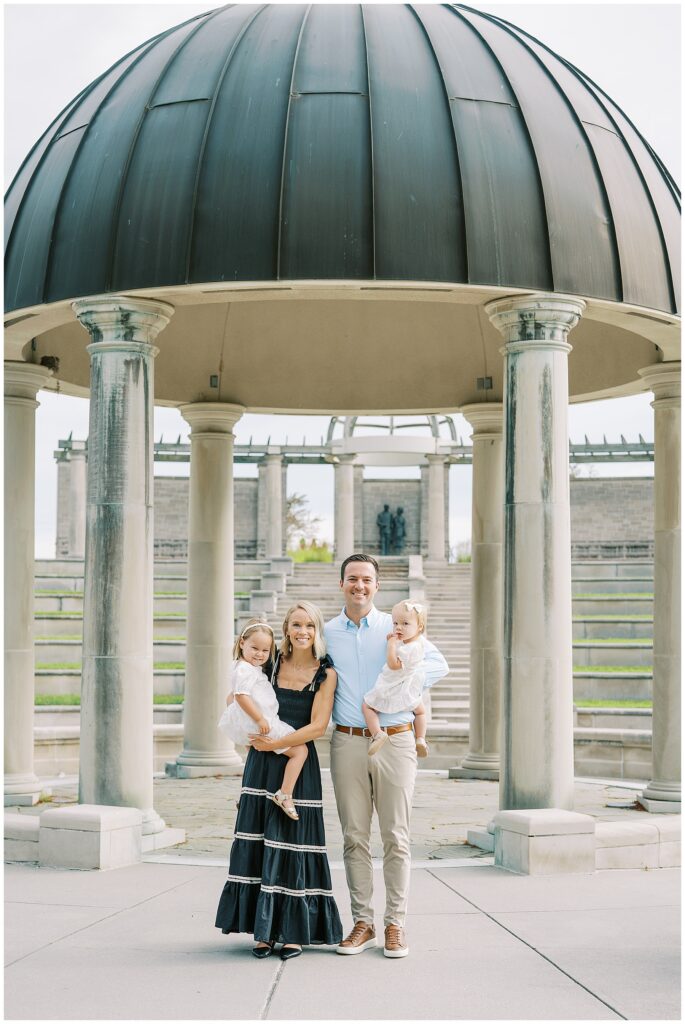 Family of four under dome at Coxhall Gardens during summer photos