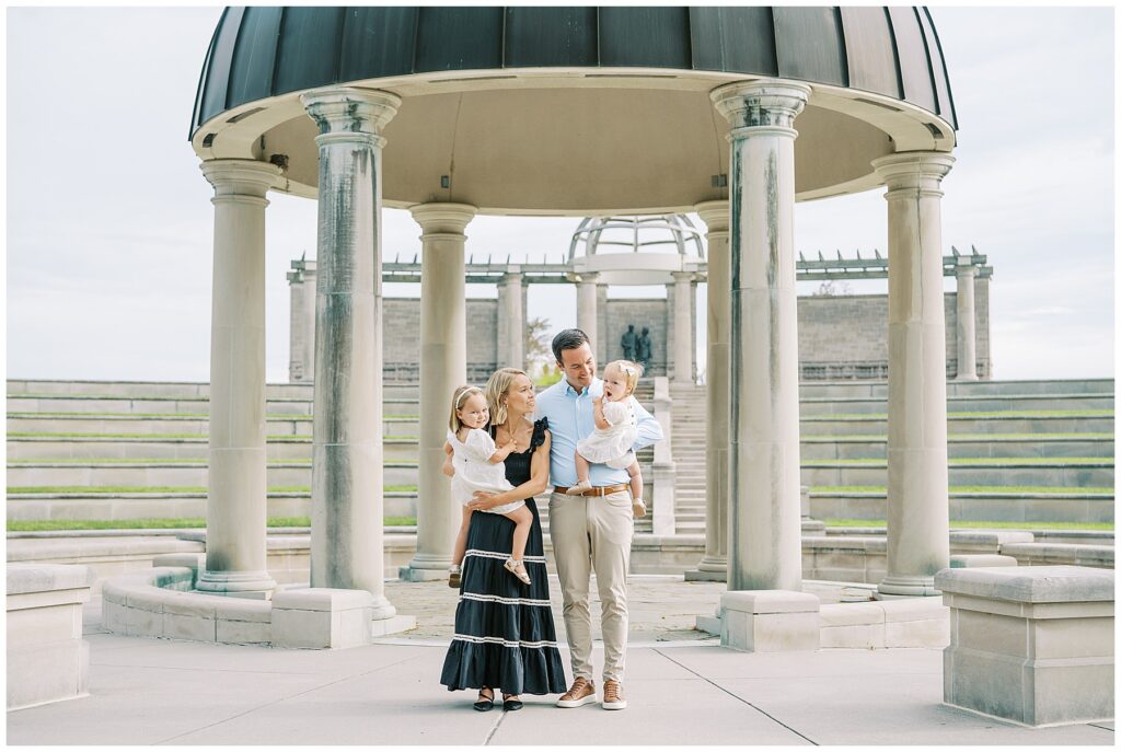 Family of four under dome at Coxhall Gardens during summer photos