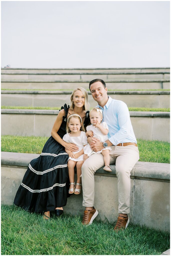 Summer family photos on grass and stone steps at Coxhall Gardens
