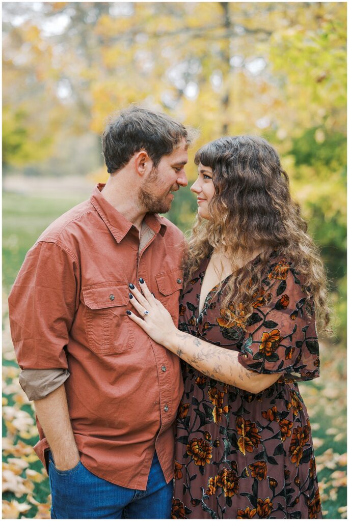 Couple in fall colors during in home family photos