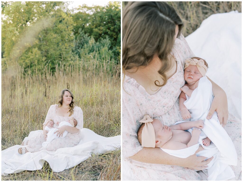 Mother in light pink holds twin newborn daughters during Carmel Indiana photo session