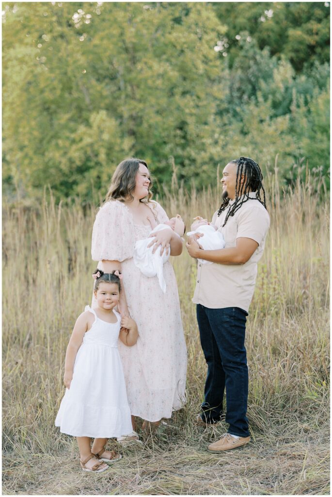 Parents with twins and older daughter during Carmel Indiana photo session