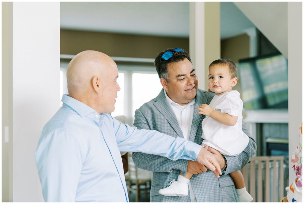 Portrait of baptized child greeting guests by Carmel, Indiana Baptism Photographer