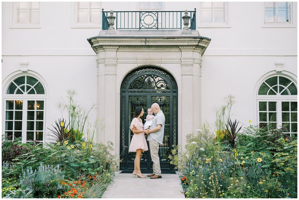 Family of three at Newfields in Indianapolis for milestone photos