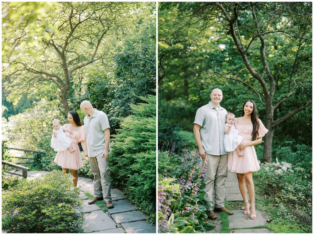 Family of three walk on garden path during milestone session